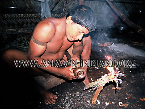 Korubo Indian repairing a blowgun